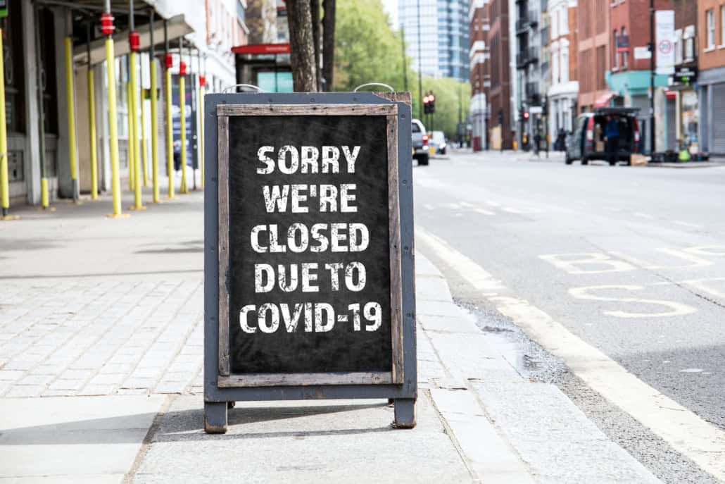 Store sign showing closed due to COVID-19